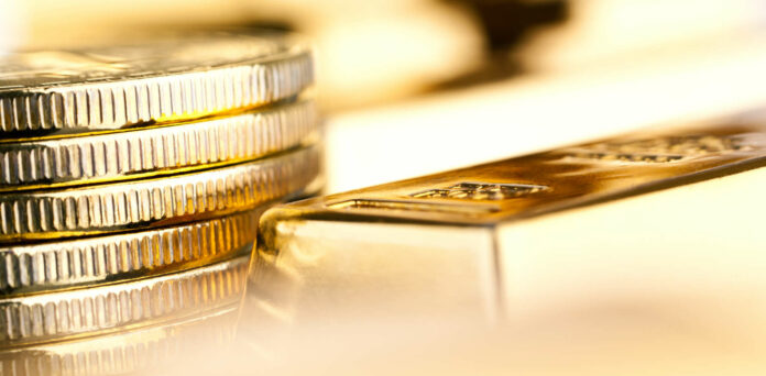 gold bars and coins close up