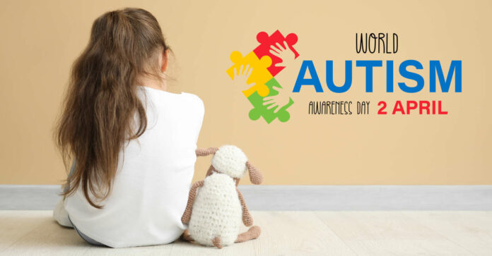 Sad little girl with autistic disorder near color wall, back