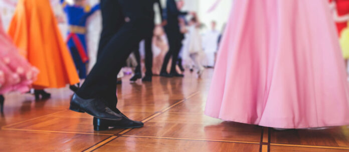 Couples dance on the historical costumed ball in historical