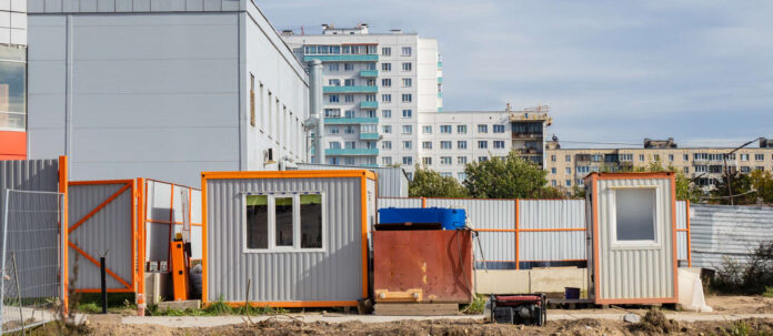 Change houses on construction site. Metal containers for sta
