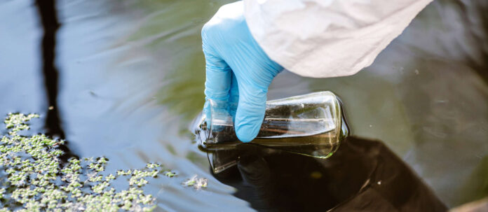 biologist working on water analysis. Ecology and environment