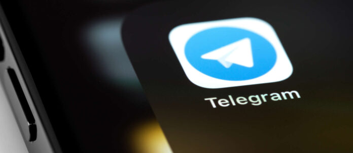 Telegram mobile icon app on screen smartphone iPhone macro.