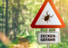 warning sign with text ZECKEN GEFAHR, German for beware of t