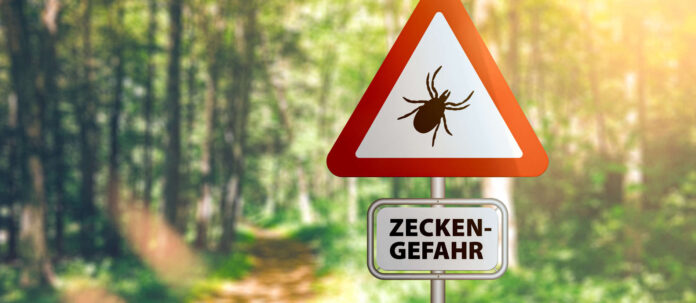 warning sign with text ZECKEN GEFAHR, German for beware of t