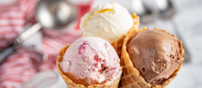 strawberry, vanilla, chocolate ice cream with waffle cone on