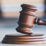 Judge's gavel on table in office