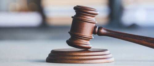 Judge's gavel on table in office