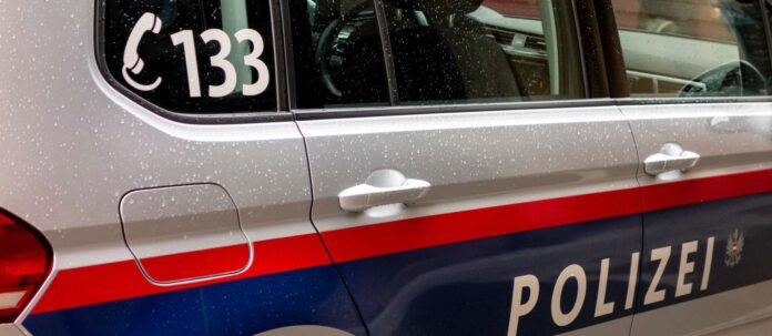 Detail of Polizei sign on a police car of Austrian police in