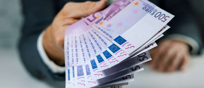 hand give 500 euro banknotes. bank money loan, consumer cred