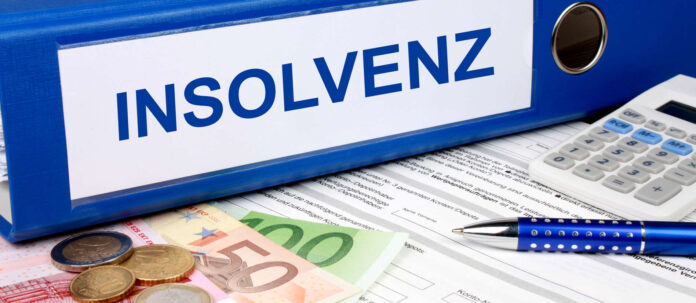 Insolvenz Ordner mit Geld und Taschenrechner